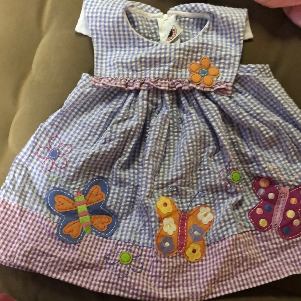 Baby girls dress. Gingham pattern